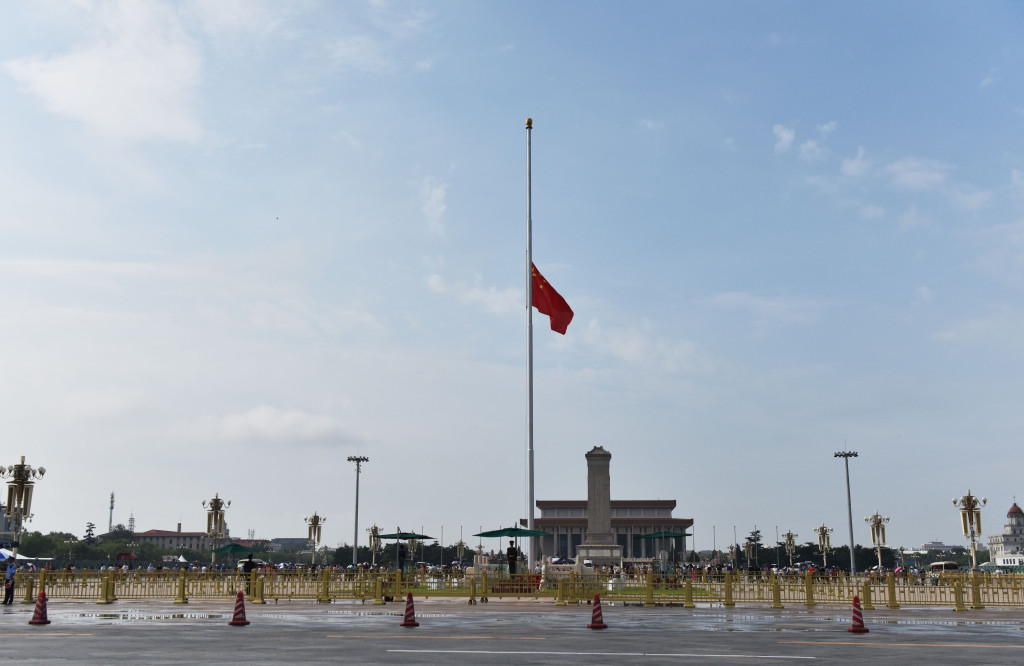 Chinese national flag flies at half-mast in Beijing Tiananmen Square on July 29, 2019, in memory of China former premier Li Peng, who died on July 22.  (Photo by GREG BAKER / AFP)