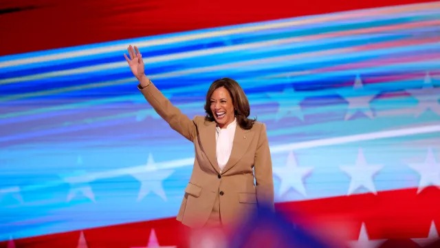 US Vice President Kamala Harris makes a surprise appearance on the first day of the Democratic Party Convention in Chicago, August 19, 2024. (AFP)